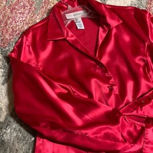 A red satin blouse. Size medium by SAGHABOR